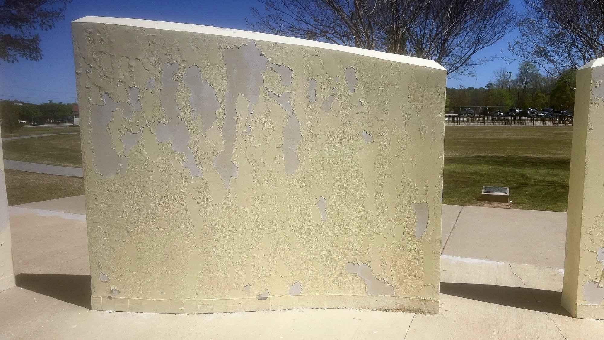 The center wall before painting, close up, the printed panel gone and the paint peeling off the concrete