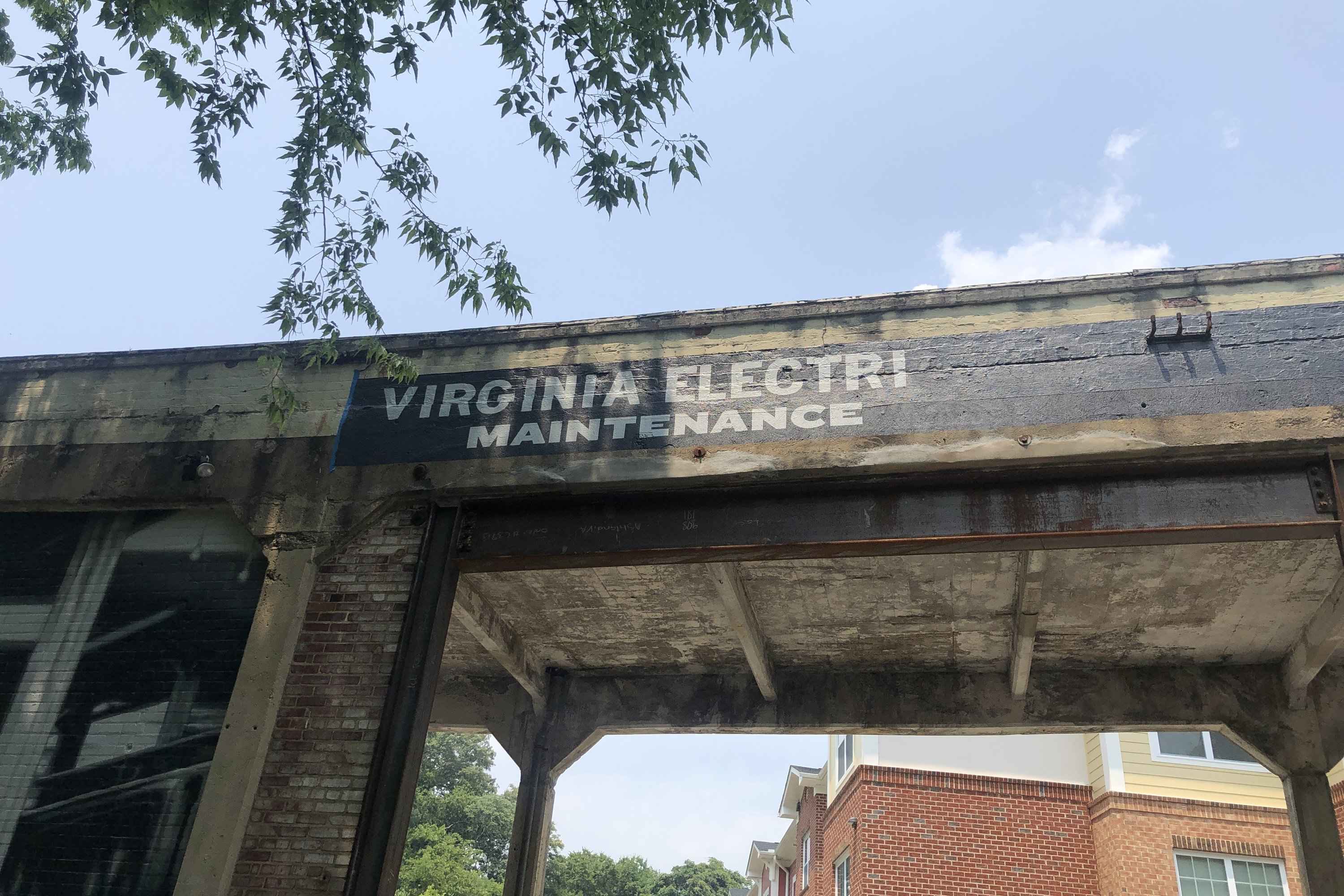 The Virginia Electric & Power Co. sign half restored, old letters beside new
