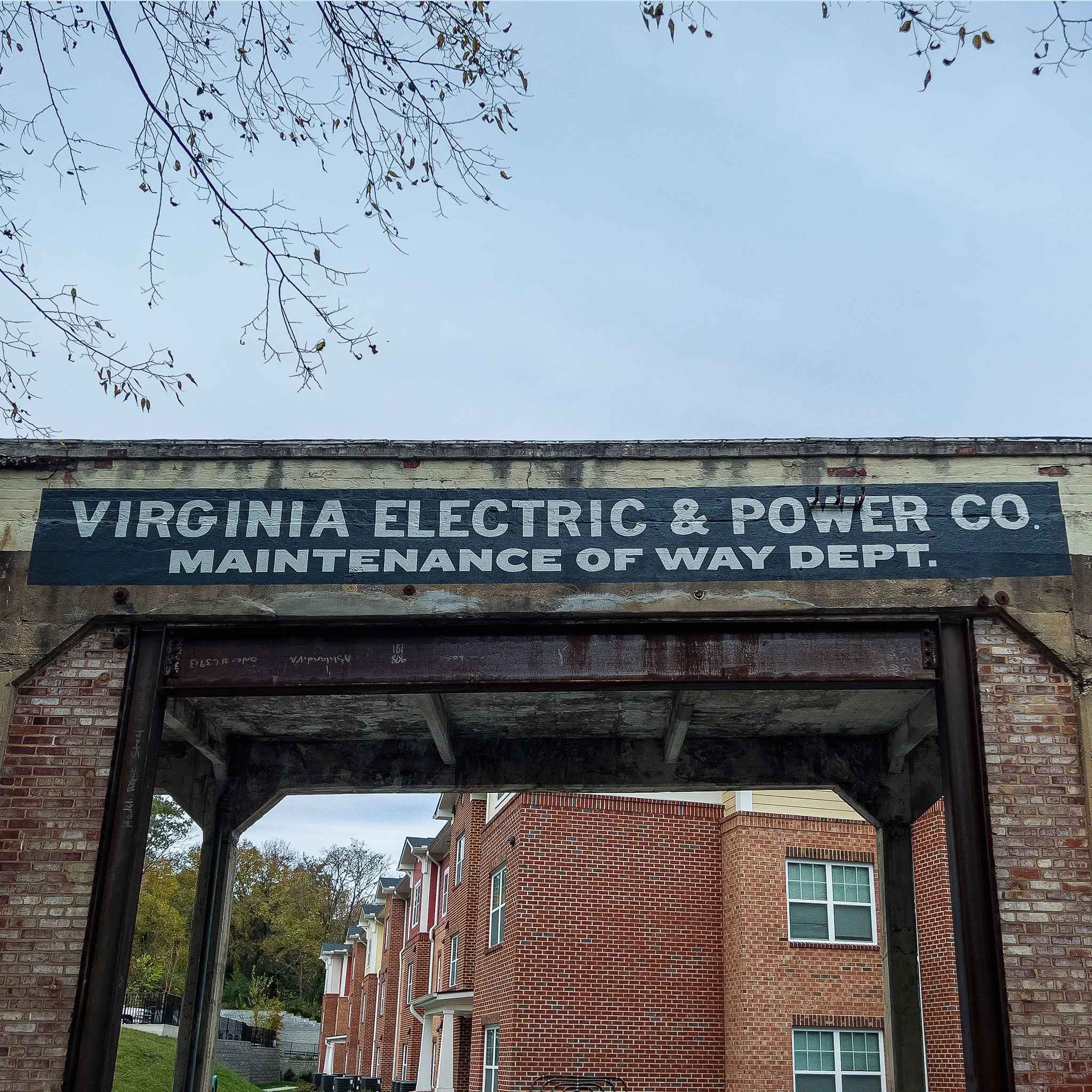 The restored sign from below: Virginia Electric & Power Co., Maintenance of Way Dept., over the open bay